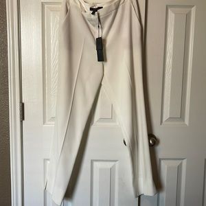 White slim fit trousers, no back pockets, side slits at bottom